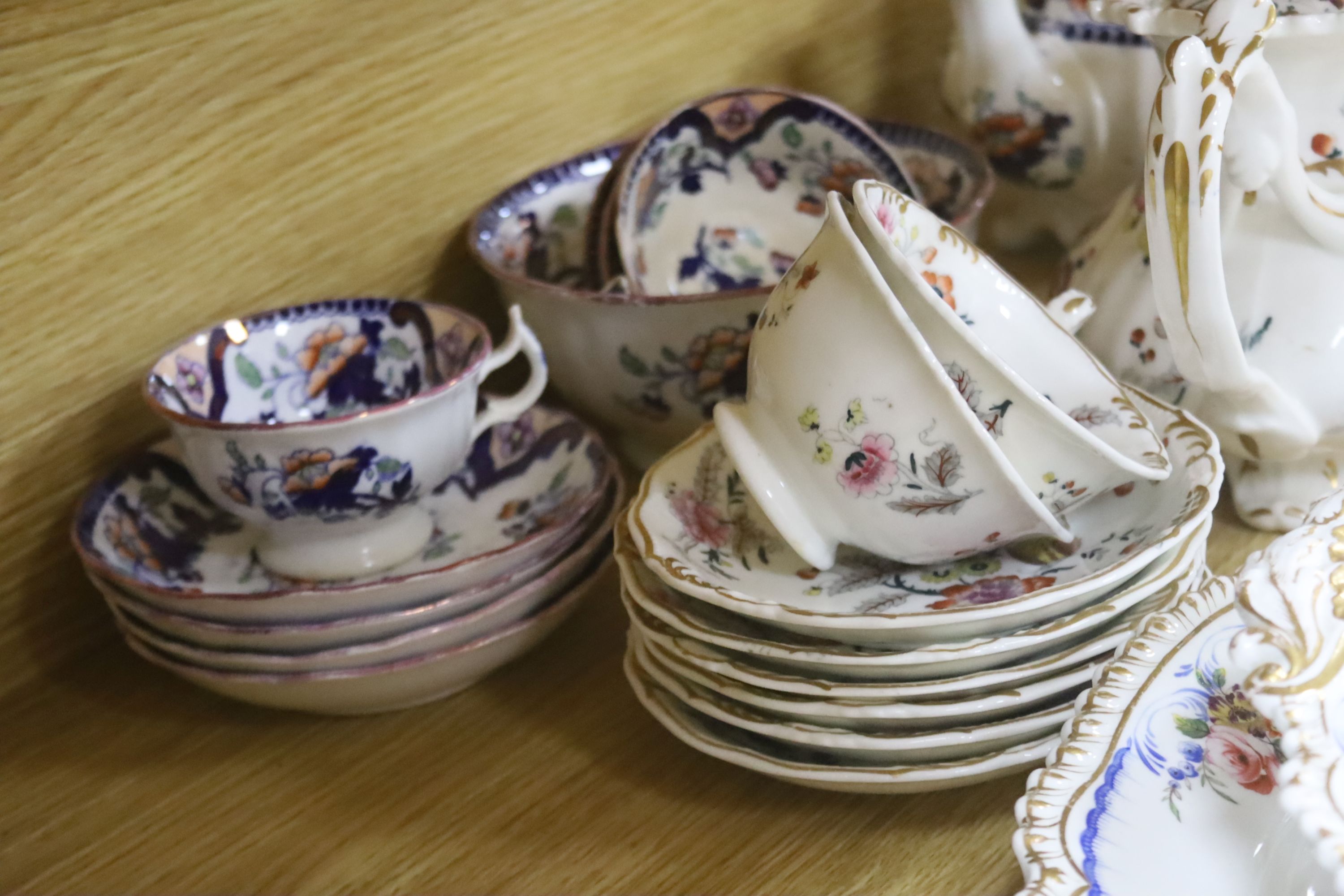 Two Victorian bone china part teasets, a covered tureen and matching meat plate